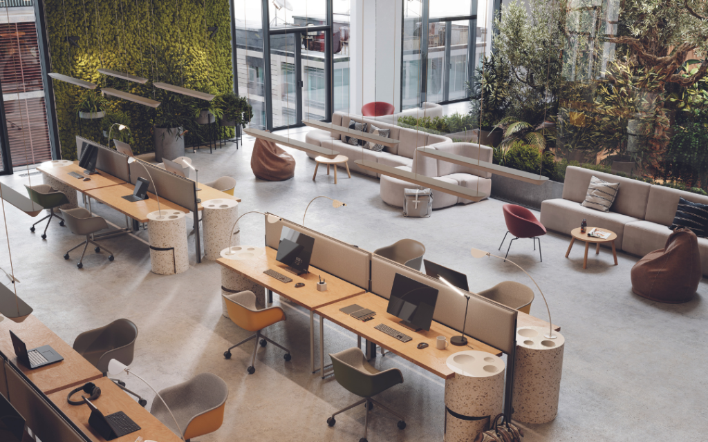 Modernes Büro mit Schreibtischen und Erholungsbereichen in einem großen Raum.